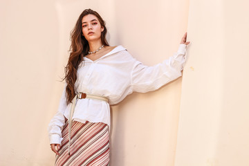 Young beautiful lady wearing a stylish white shirt.Portrait shooting of a stylish girl.Trends...
