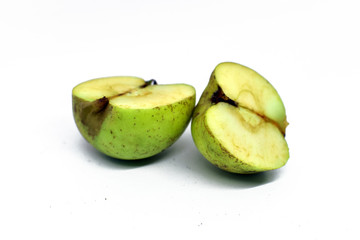 green apple cut into two parts. Isolated on white background
