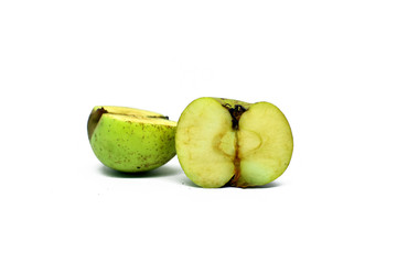 green apple cut into two parts. Isolated on white background