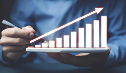 Graph on tablet. Concept of financial growth