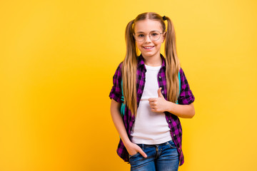 Closeup photo of little lady return classroom thumb up wear specs checkered shirt jeans denim isolated yellow background