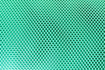 Green plastic mesh looks like an illusion.