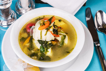 Mediterranean squid, chicken, crab meat and vegetable soup