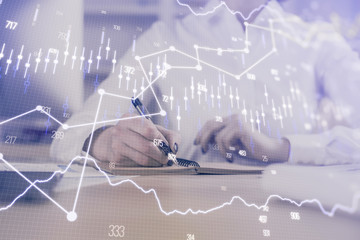 Financial chart drawn over hands taking notes background. Concept of research. Multi exposure