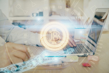 Blockchain theme hud with man working on computer on background. Concept of crypto chain. Double exposure.