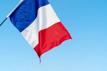 Flag of France waving in the wind in the sky