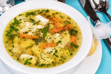 Mediterranean recipe for chicken, vegetables and seafood on a blue background