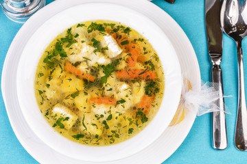 Mediterranean recipe for chicken, vegetables and seafood on a blue background