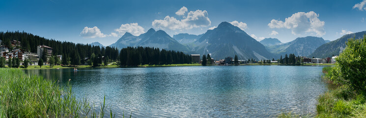 panorama landscape view of the lake and town of Arosa in the Swiss Alps