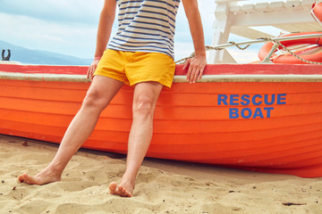 Rescue boat and lifeguard keeping the beach safe in summertime period.