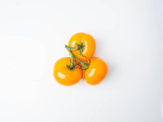 fresh yellow tomatoes isolated on white background