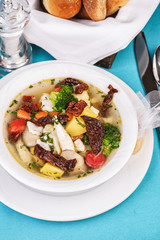 Knoop of veal and seafood with vegetables according to the Mediterranean recipe