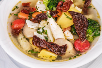 Knoop of veal and seafood with vegetables according to the Mediterranean recipe