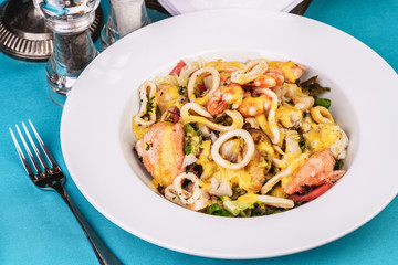 Mediterranean stew with colmar rings, crab meat, chicken and cheese.