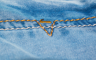 Blue denim fabric with seams for design background