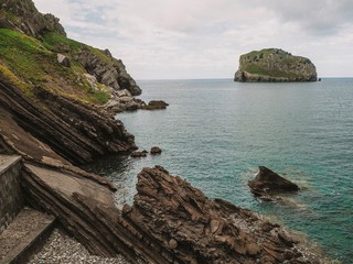 Cliffs, rocks and islets that are visible from the top of the island Gaztelugatxe on the coast of the Bay of Biscay