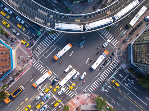 Aerial view of cars and trains with intersection or junction with traffic, Taipei Downtown, Taiwan. Financial district and business area in transportation smart urban city technology concept.