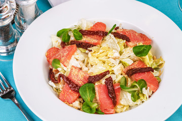Mediterranean salad. Cabbage, tomatoes, smoked seeds, olives, olives, basil and rosemary, seasoned with olive oil and balsamic sauce