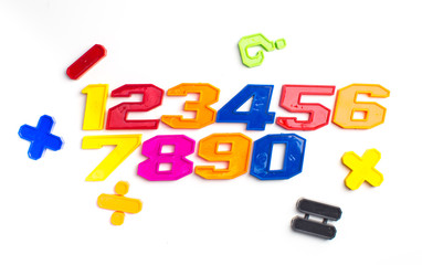 Fototapeta premium Heap of plastic colored arithmetic numbers close up.