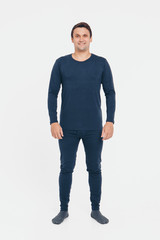 the concept of advertising pajamas, underwear - handsome man shows off gray clothes on a white background