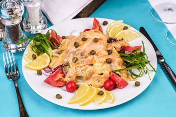 Roast with cream sauce, with Colmar, shrimps, tomatoes, decorated with nuts and onions according to...