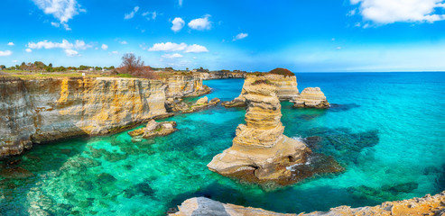 Picturesque seascape with cliffs, rocky arch at Torre Sant Andrea