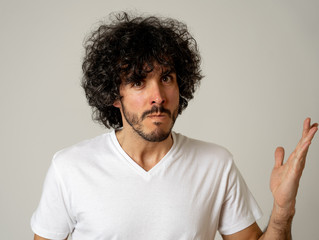 Portrait of young man with angry face looking furious. Human expressions and emotions
