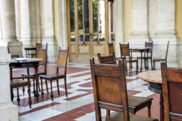 Fototapeta na wymiar European restaurant exterior, empty chairs, lonely place, saddness, autumn