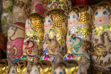 Golden painted wooden matryoshka at the market