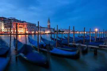 The famous Gondolas are parking on the Canal Grande in the evening in Venice, Italy