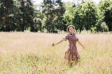 Young girl dancing in the field