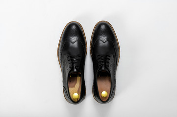 Classic male leather shoes. Isolated on white background. Top view