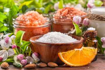 Spa and skin care products sea bath salts, oils and cream on rustic background