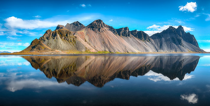 Splendid sunny day and gorgeous reflection of Vestrahorn mountaine on Stokksnes cape in Iceland.