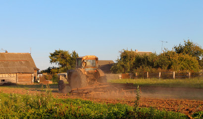 Tractor working in field