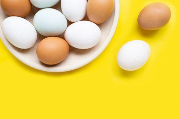 Eggs on yellow background.