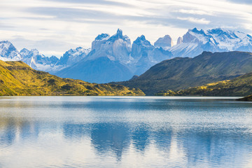 Beautiful panoramic view of lake with Cuernos, horn mountains peak with lenticular cloud in autumn, Torres del Paine national park, south Patagonia, Chile