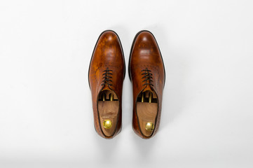 Classic male leather shoes. Isolated on white background. Top view