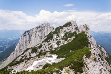 Unrecognizable people on top of the Grosser Donnerkogel Mountain in Alps, Gosau, Gmunden district, Upper Austria federal state, sunny summer day, clear blue sky, exploration wanderlust concept