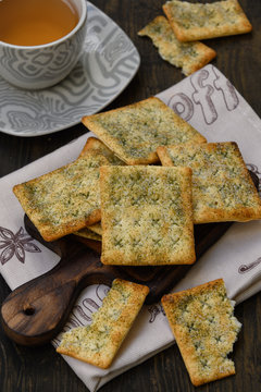Close-up of crackers and a cup of tea