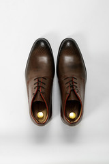 Classic male leather shoes. Isolated on white background. Top view