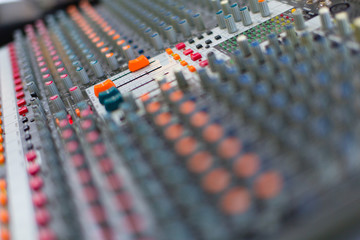 Analog sound mixer with selected focus. Professional audio mixing console radio and television...