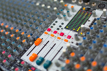 Analog sound mixer with selected focus. Professional audio mixing console radio and television...