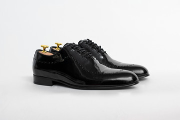 Classic men's shoes on a white isolated background. Angle view from the front