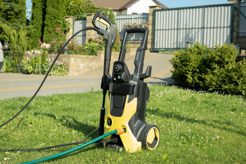 mini home pressure washer for cleaning the car  in the garder in summer