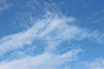 Beautiful clouds floating on the vast blue of the sky
