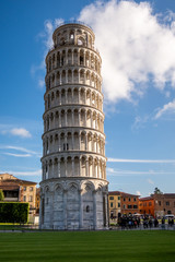 Fototapeta na wymiar The sunlit iconic Leaning Tower of Pisa. Tuscany, Italy