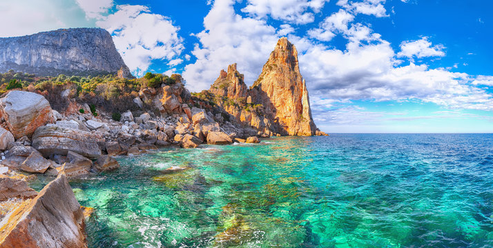 Spectacular view of Punta Pedra Longa and azure water in sea.