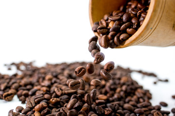 cup of coffee with beans on white background