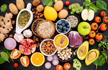 Ingredients for the healthy foods selection. The concept of healthy food set up on wooden background.